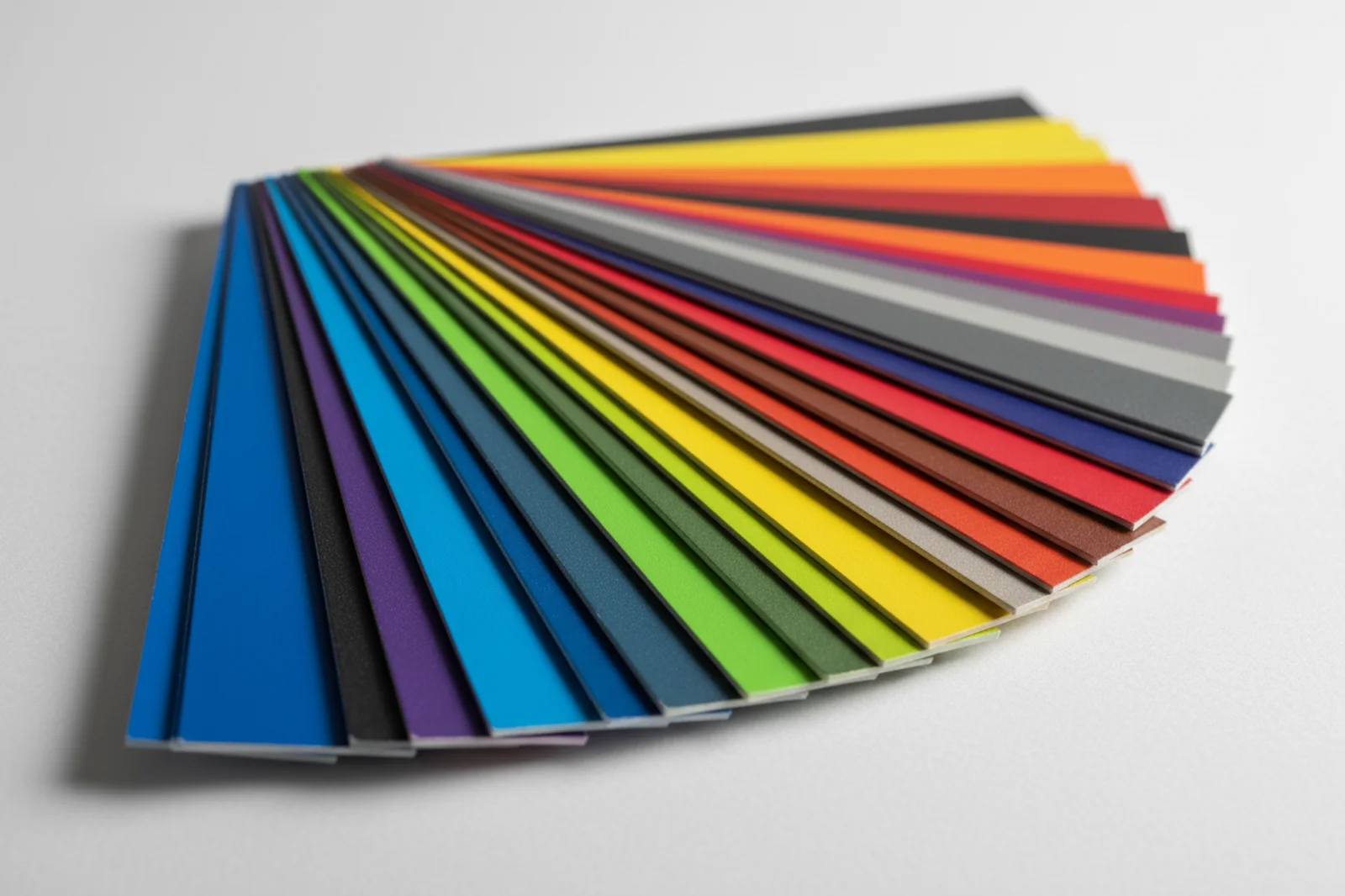 A fanned deck of powder coating colour sample chips